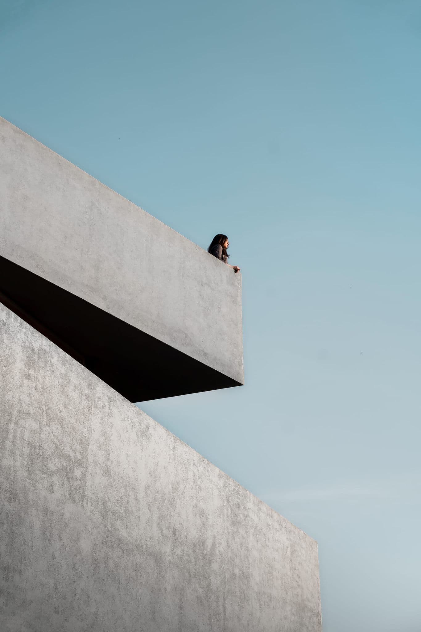 Minimal concrete ledge at Hira cutting into a clear blue sky