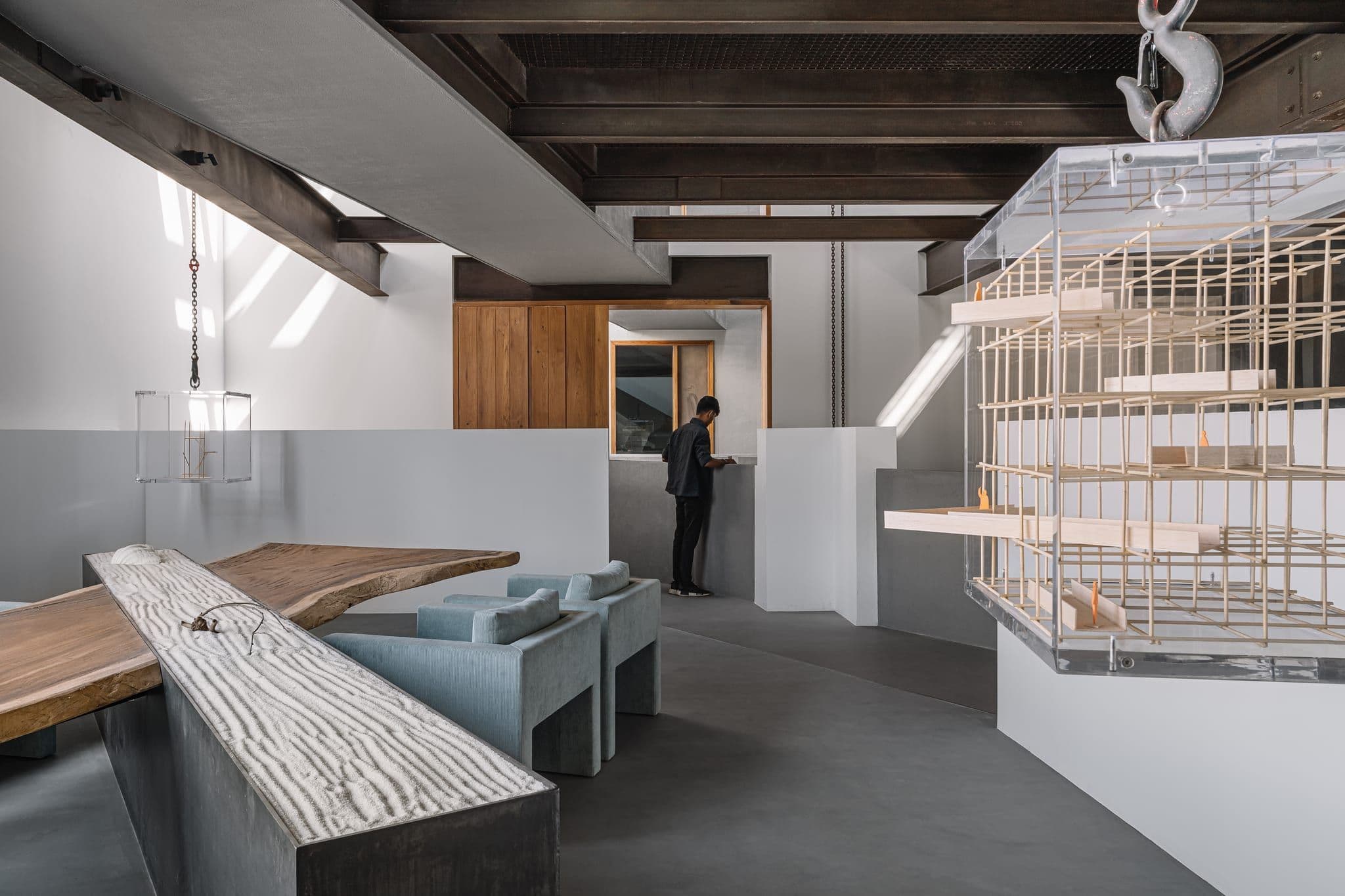 Fulcrum Studio main desk workspace under industrial ceiling